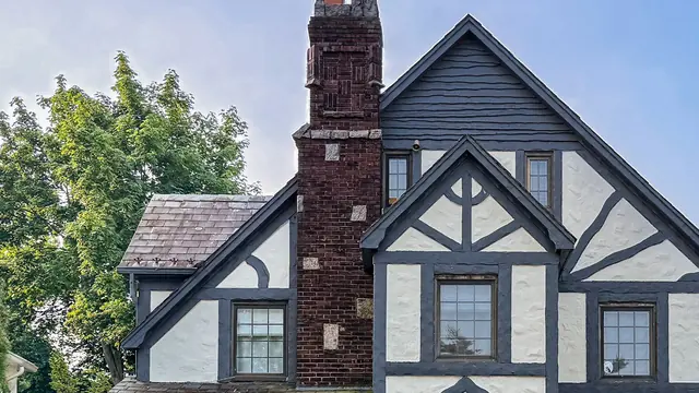 The same roofline and chimney close up, where twelve months of weather actually lands